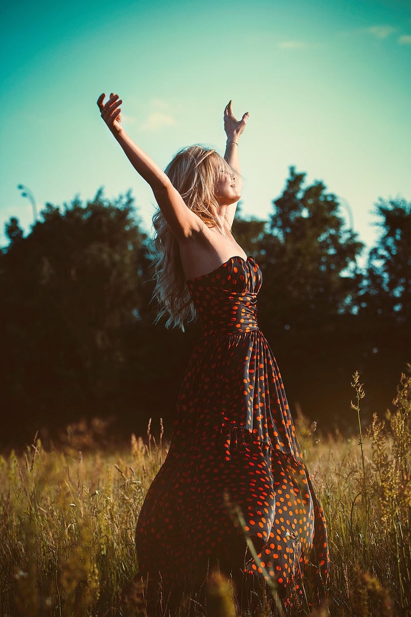 Woman in a dreamy dress in a field